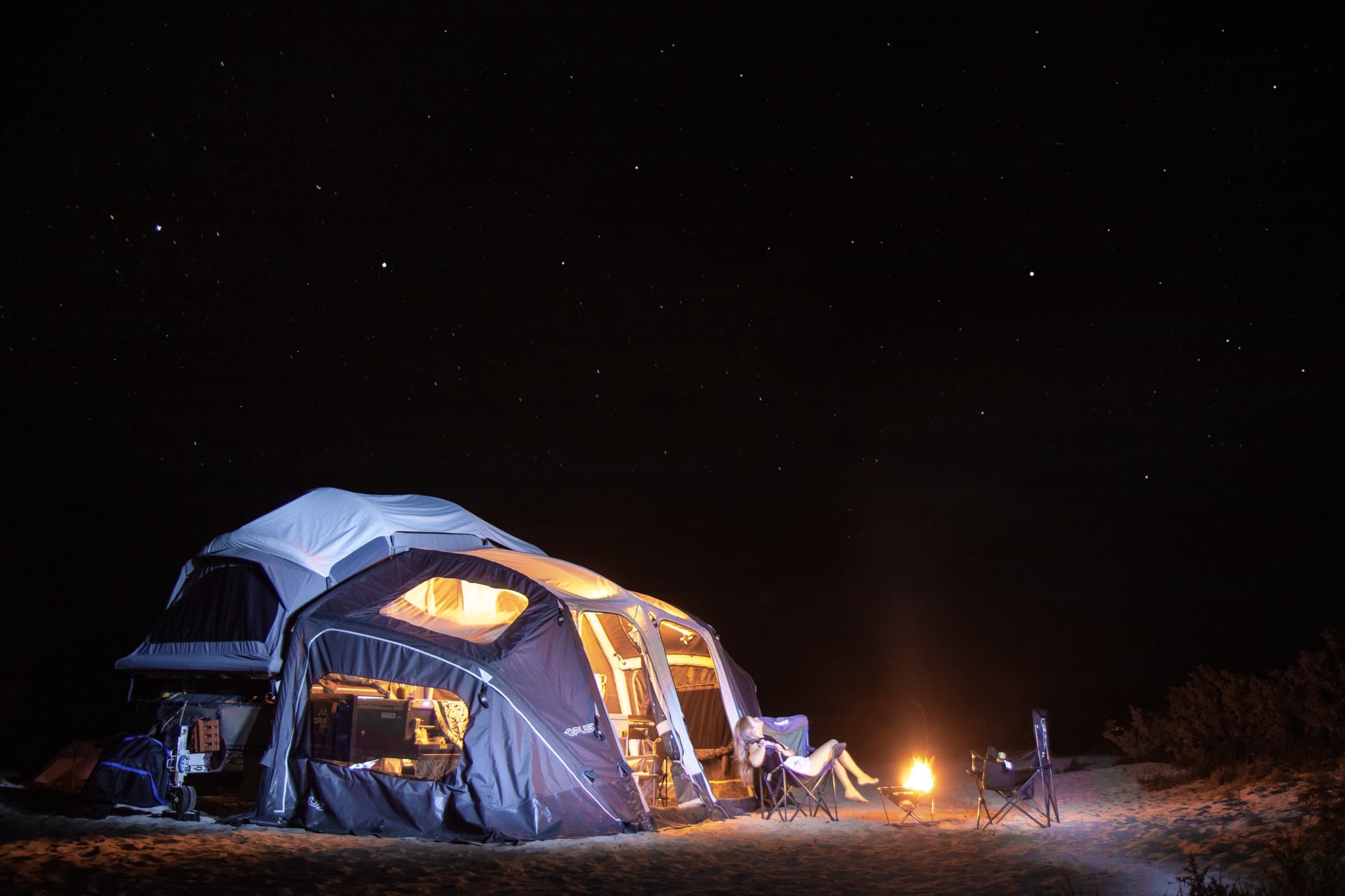 OPUS OP4 set up at camp with the annexe lit at night